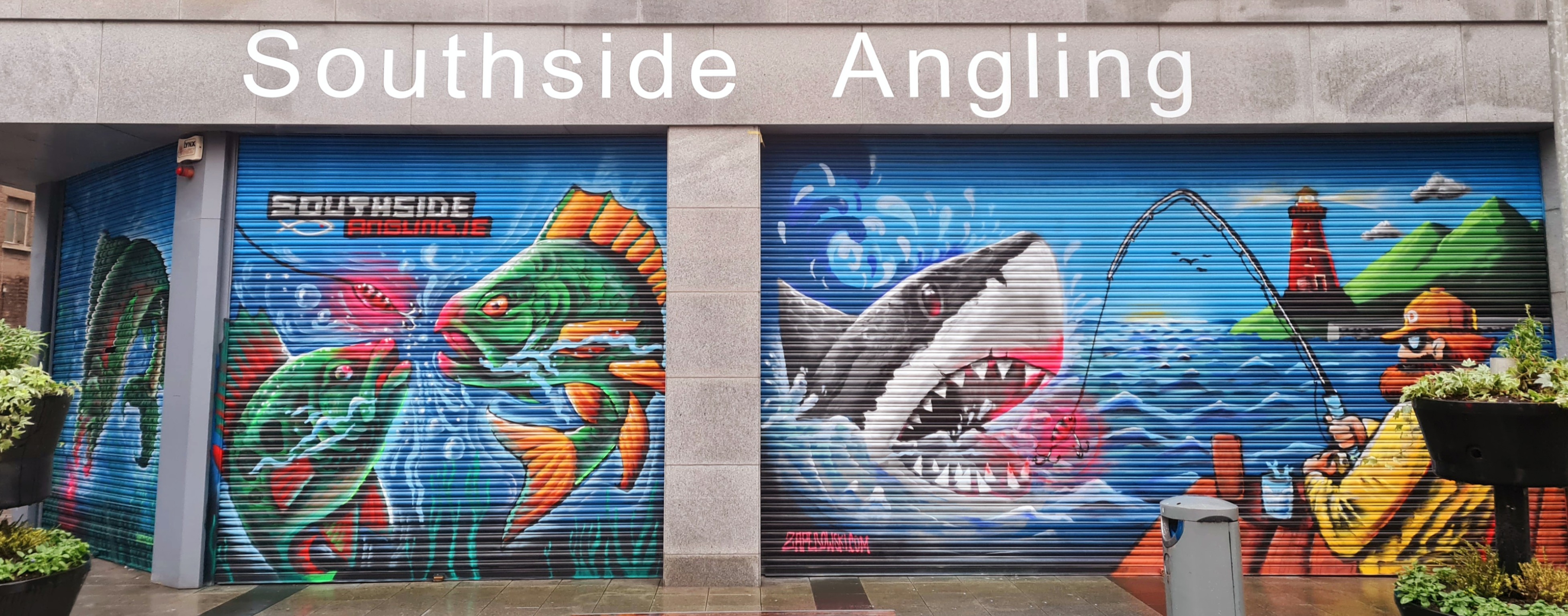 Vibrant marine life mural featuring fish and ocean scenery painted on a Dublin shop by ZAP Art
