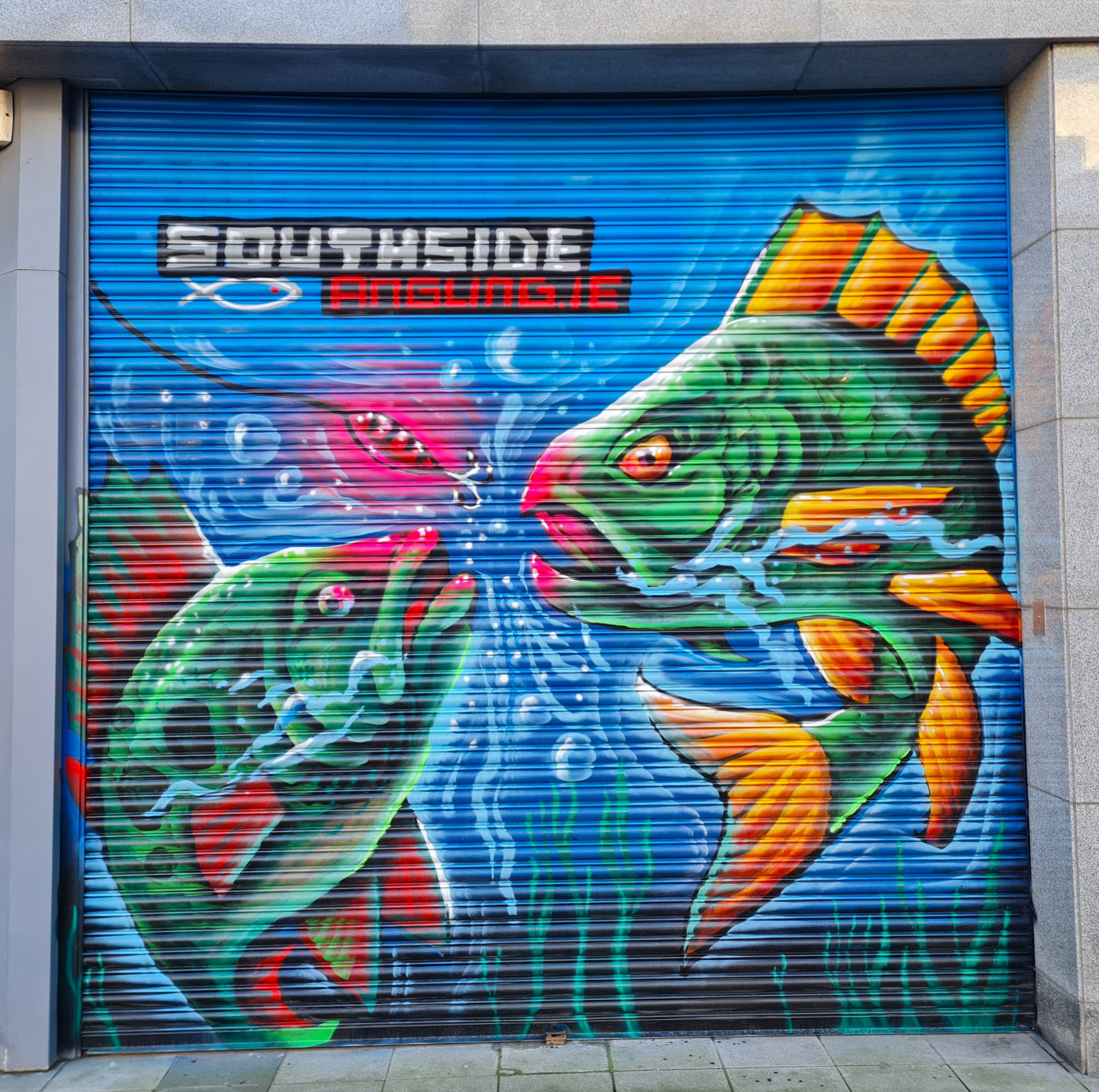 Large-scale fishing shop mural with realistic aquatic details painted in Dublin by ZAP Art