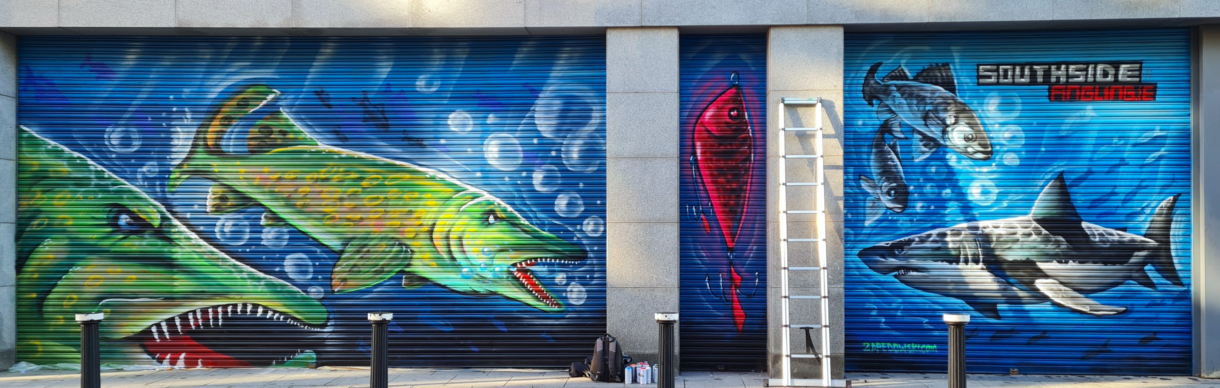 Expansive fishing shop facade mural featuring underwater wildlife painted in Dublin by ZAP Art