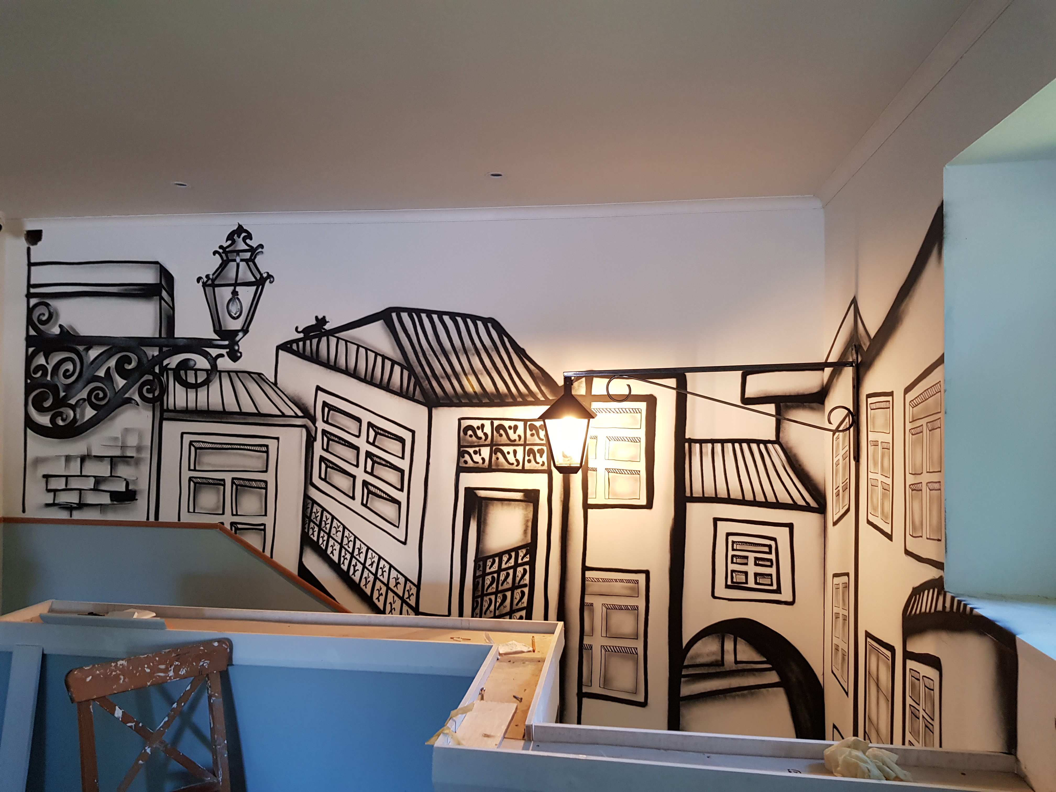 Vibrant Lisbon-inspired mural featuring colourful buildings painted in a Dublin Portuguese restaurant by ZAP Art